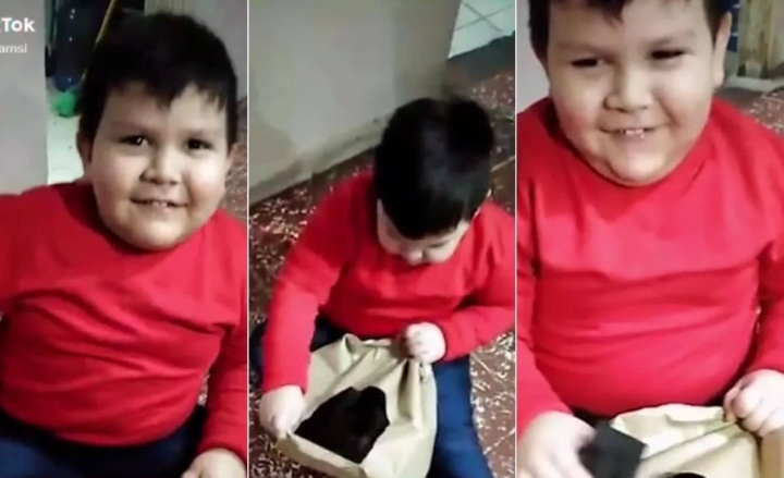 Niño recibe carbón como regalo de Navidad.